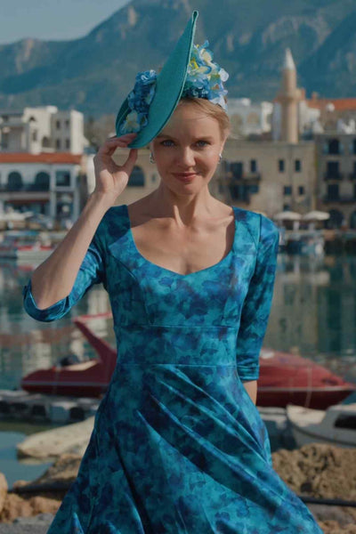 A lady wearing a Blue Watercolour Floral Midi Dress