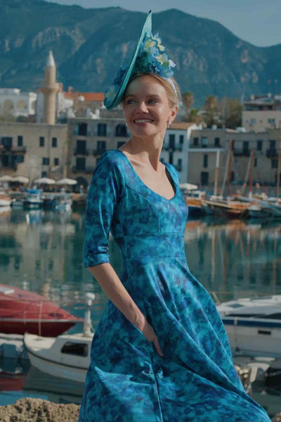 A lady wearing a Blue Watercolour Floral Midi Dress
