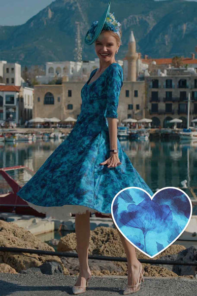 A lady wearing a Blue Watercolour Floral Midi Dress