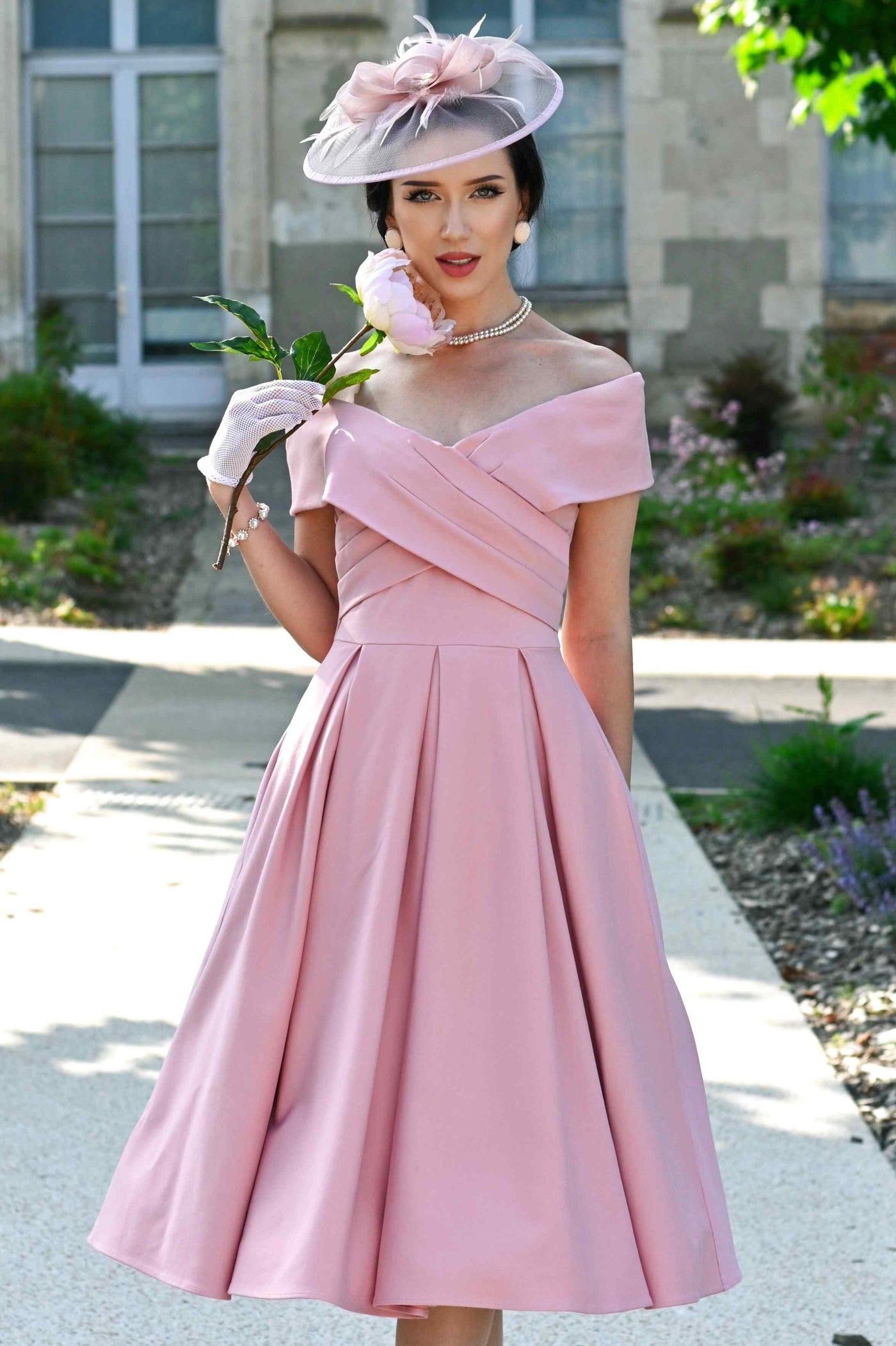 A lady wearing a Blush Pink Off Shoulder Dress