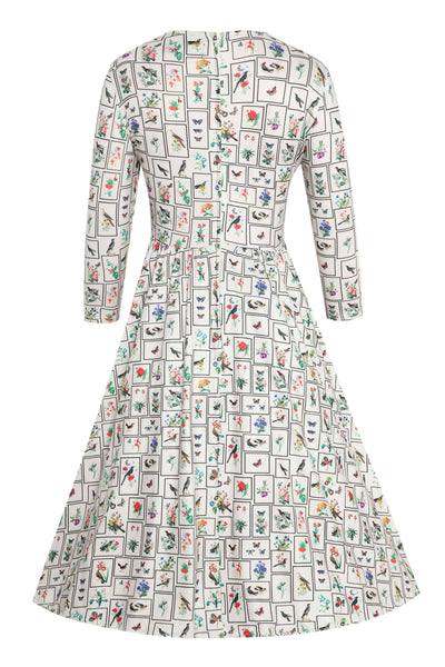 Back view of Botanical and Bird  Print Flared Dress in Cream