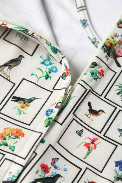 Close up view of Botanical and Bird  Print Flared Dress in Cream