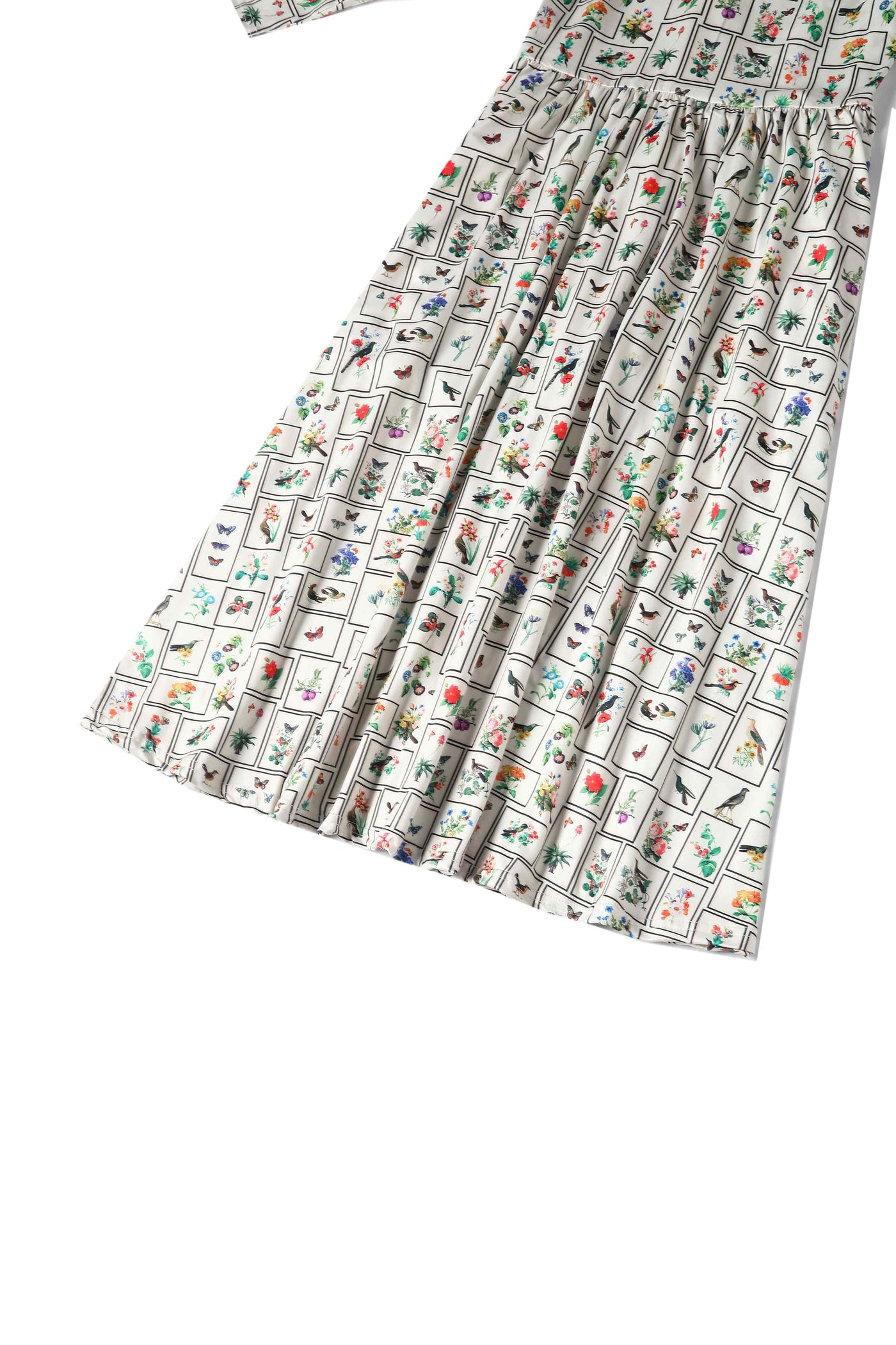 Close up view of Botanical and Bird  Print Flared Dress in Cream