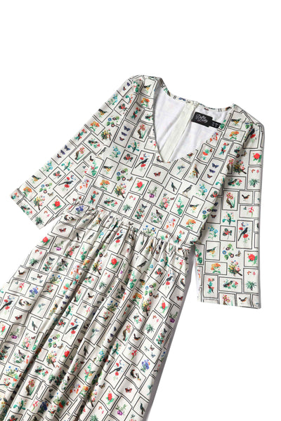 Close up view of Botanical and Bird  Print Flared Dress in Cream