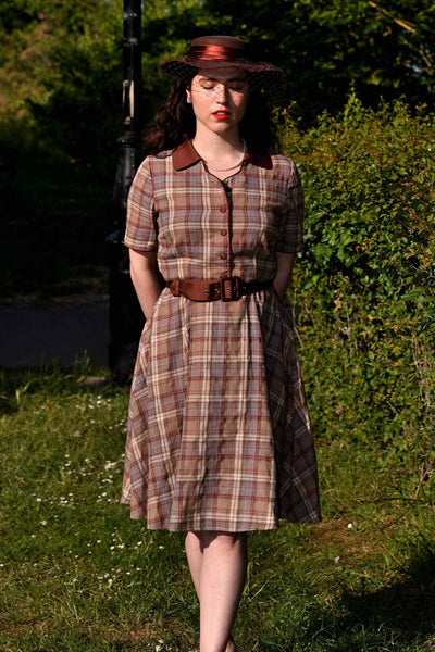 A model wearing a Brown Tartan Shirt Dress