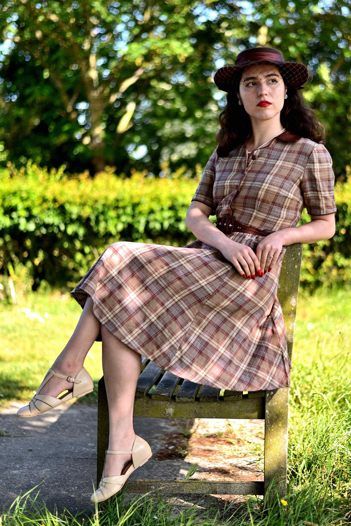 A girl wearing a Brown Tartan Shirt Dress