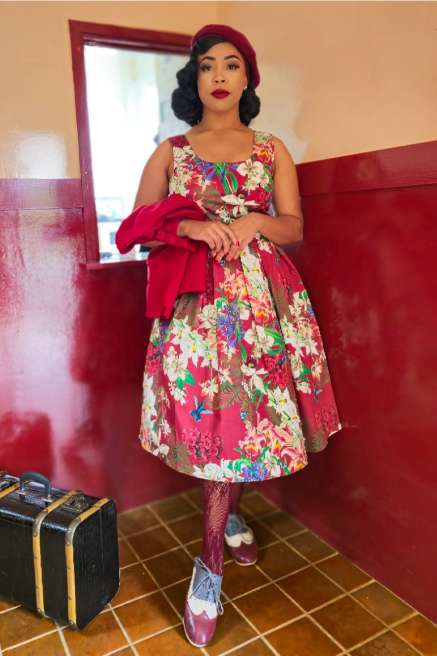 A model wearing a Amanda Burgundy Botancial Floral Swing Dress In Cotton