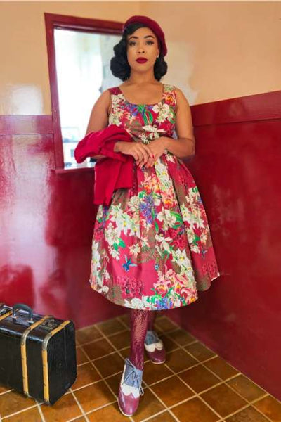 A model wearing a Amanda Burgundy Botancial Floral Swing Dress In Cotton