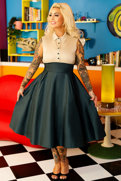 A model wearing a Button Up Shirt Dress in Cream and Dark Green