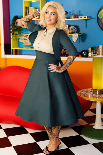 A model wearing a Button Up Shirt Dress in Cream and Dark Green