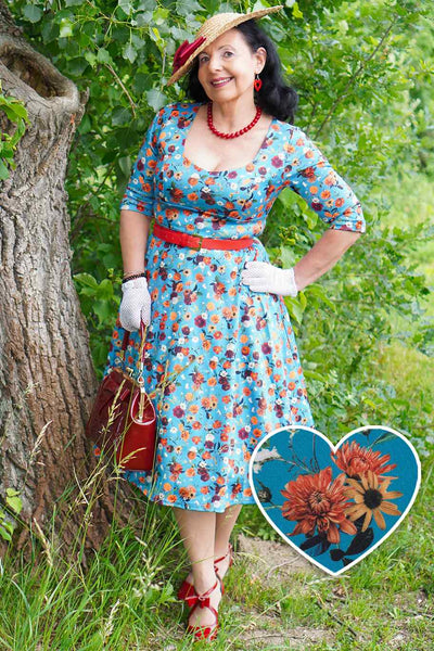 A model wearing a Carnation Blue Midi Dress