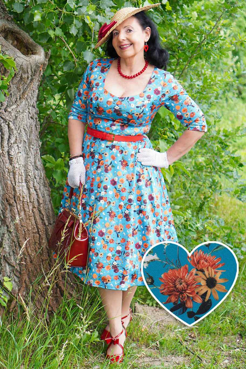 A model wearing a Carnation Blue Midi Dress