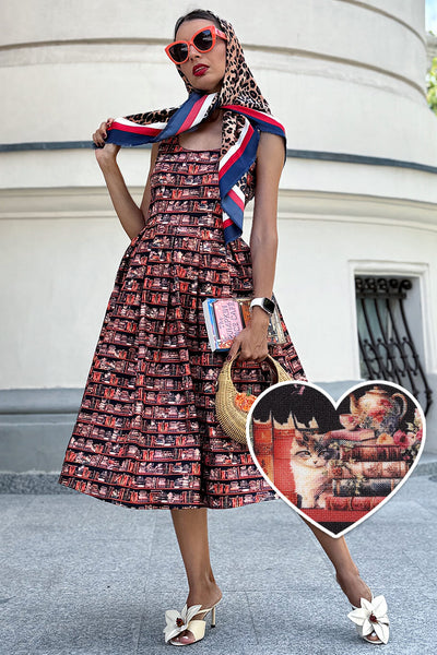 A model wearing an Amanda Cat and Book Swing Dress