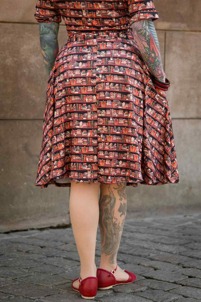 Model wearing a Cat & Book Wrap Dress