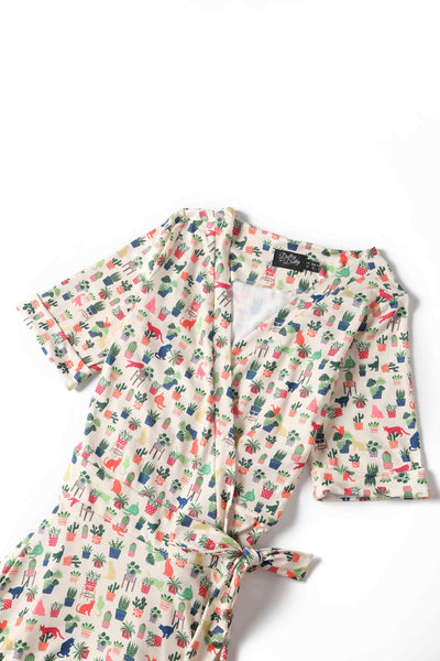 Close up view of Cat & Plant Wrap Dress In White