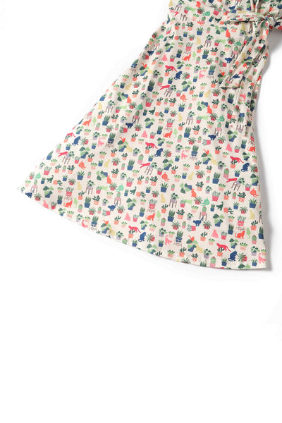 Close up view of Cat & Plant Wrap Dress In White