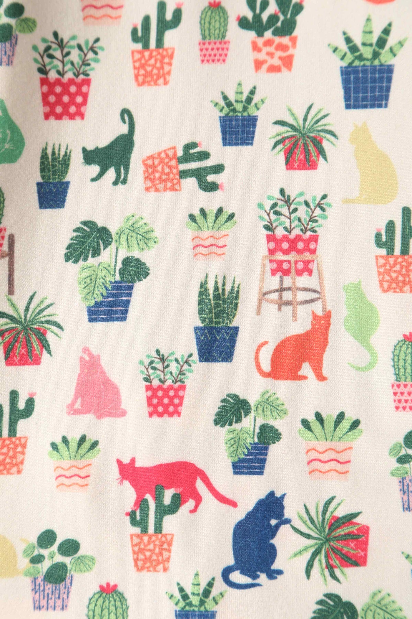 Close up view of Cat & Plant Wrap Dress In White