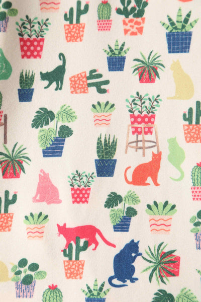 Close up view of Cat & Plant Wrap Dress In White