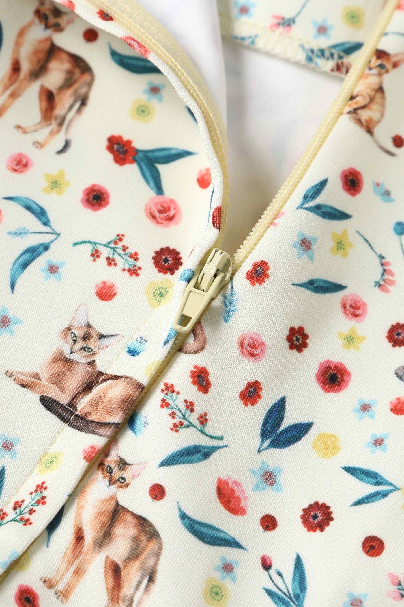 Close up view of Ivory Cream Flared Dress in Cat Floral Print