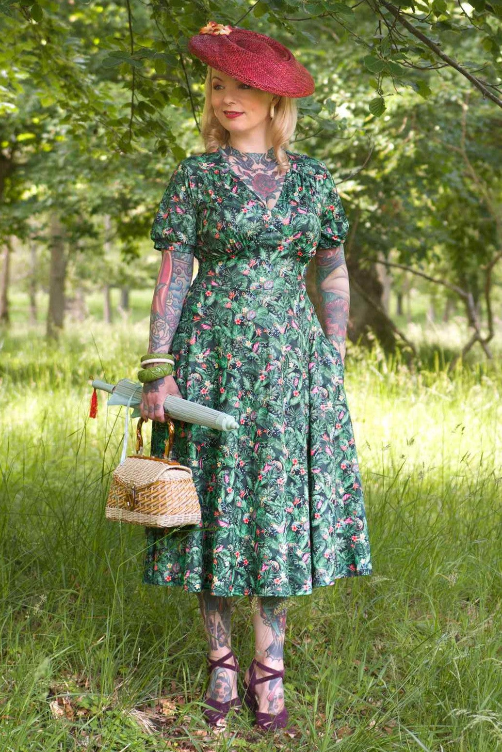 A woman wearing Chameleon Midi Dress In Green