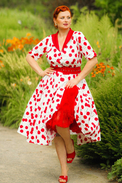 A lady wearing a Mollie Cherry Full Circle Shirt Dress In White