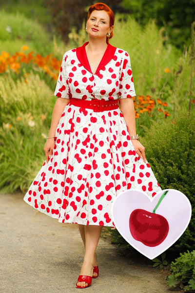 A model wearing a Mollie Cherry Full Circle Shirt Dress In White