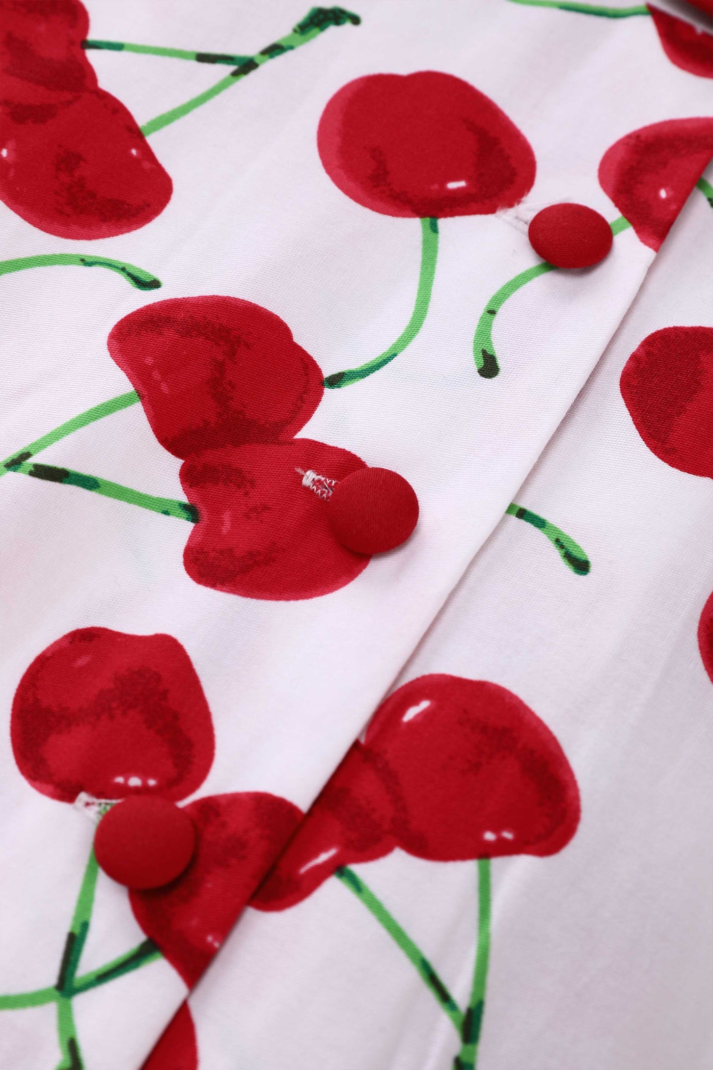 Close up view of Mollie Cherry Full Circle Shirt Dress In White