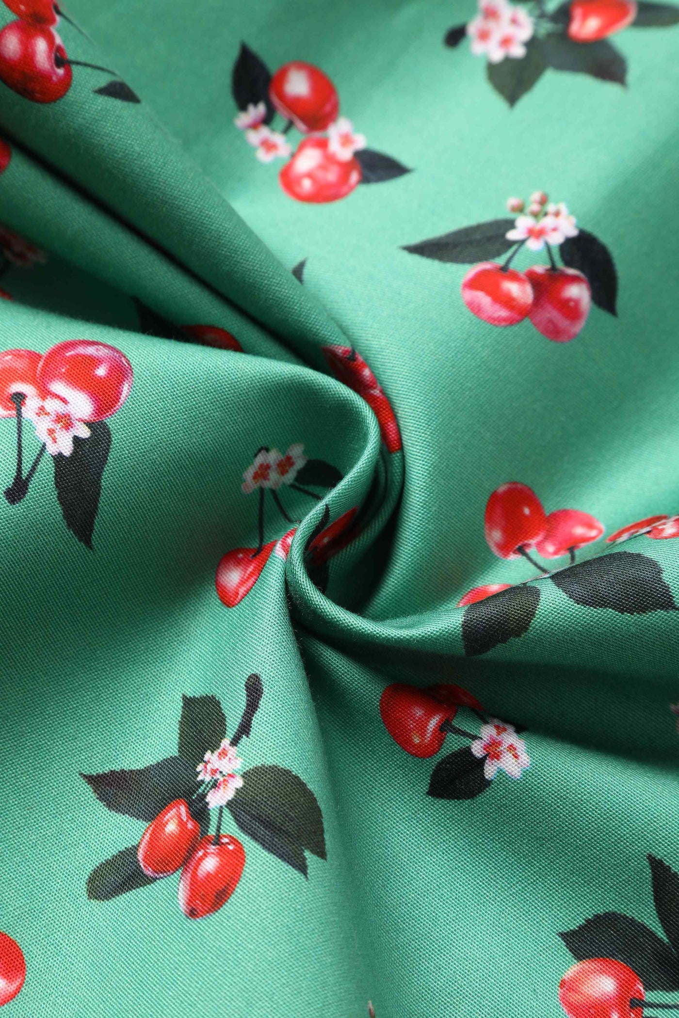 Close up View of Cherry Pleated Bust Dress in Emerald Green