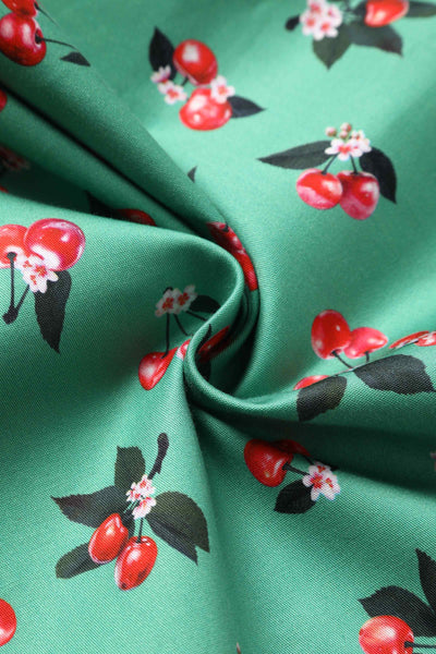 Close up View of Cherry Pleated Bust Dress in Emerald Green