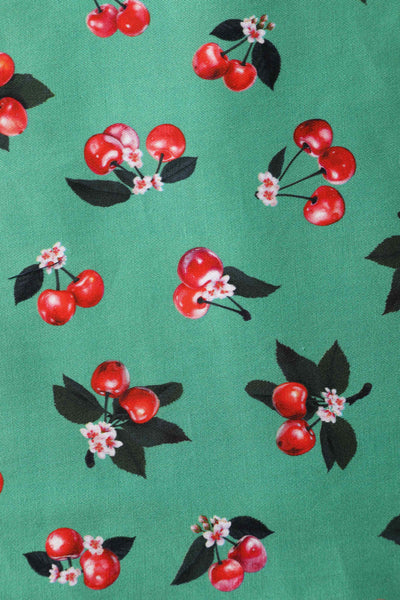 Close up View of Cherry Pleated Bust Dress in Emerald Green