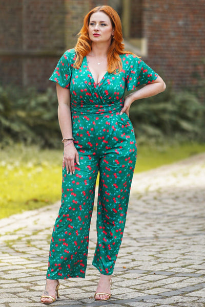 A model wearing a Emerald Green Cherry Jumpsuit