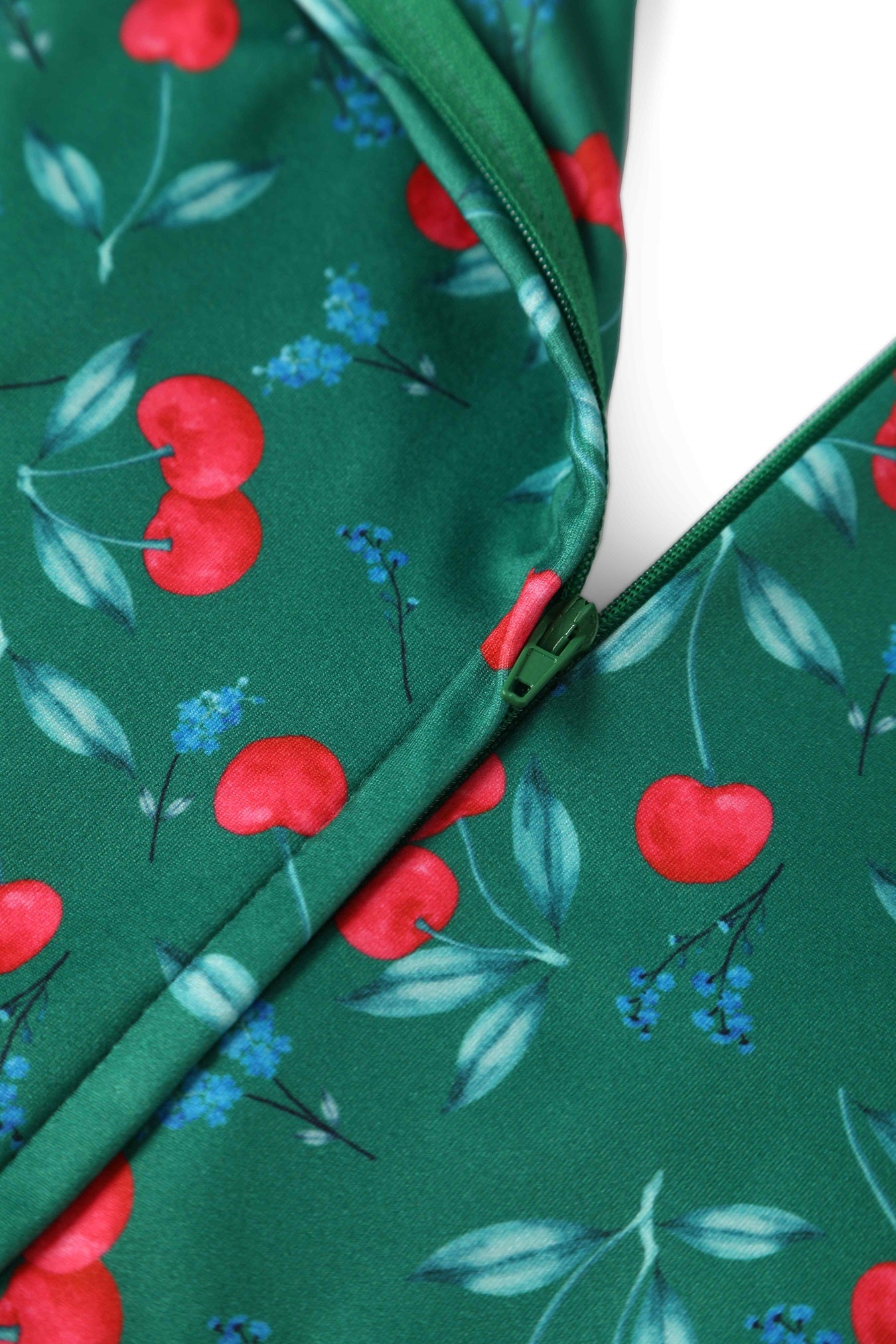 Close up View of Cherry Print Jumpsuit in Emerald Green
