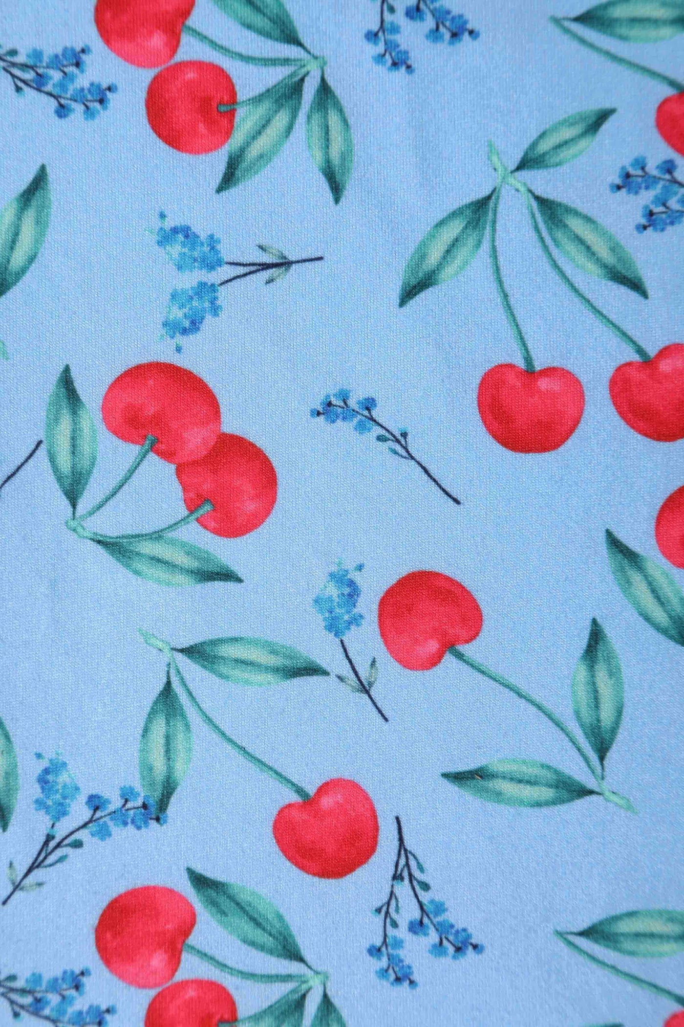 Close up view of Cherry Print Summer Tea Dress in Blue