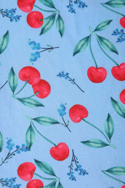Close up view of Cherry Print Summer Tea Dress in Blue