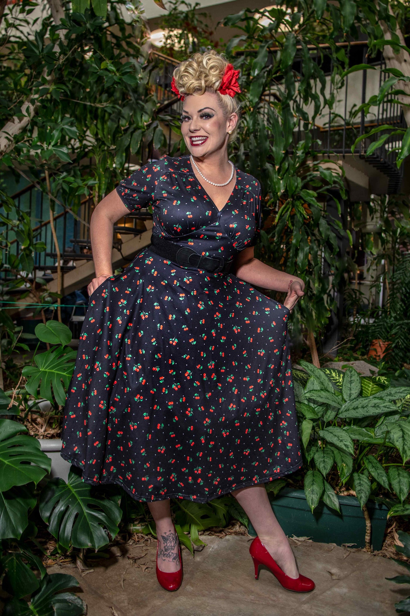 Model photo front view of Cherry Print Tea Dress in Black
