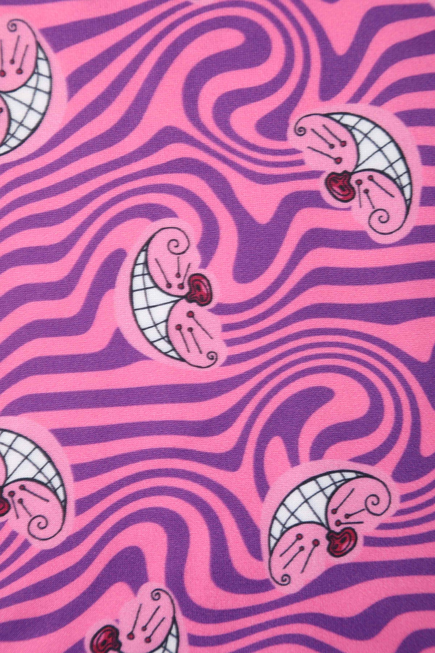 Close up view of Cheshire Cat Print Swing Dress in Pink