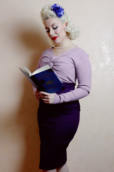 Woman wears our purple skirt, with accessories, front view