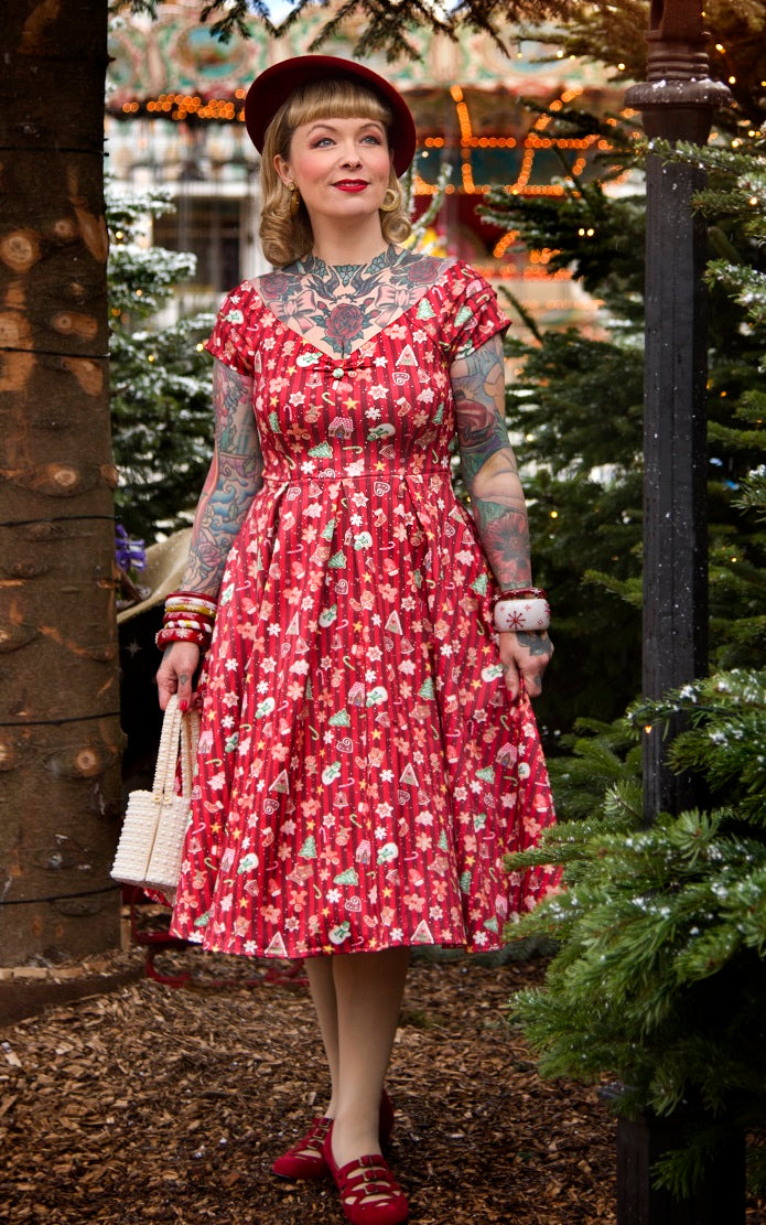 A model wearing a Lily Christmas Gingerbread Cookie Off Shoulder Dress