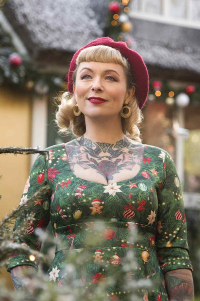 Close up view of model wearing Christmas Tree Long Sleeved Dress