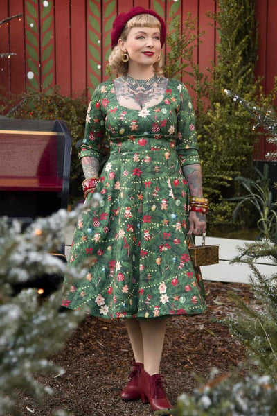 A model wearing Christmas Tree Long Sleeved Dress