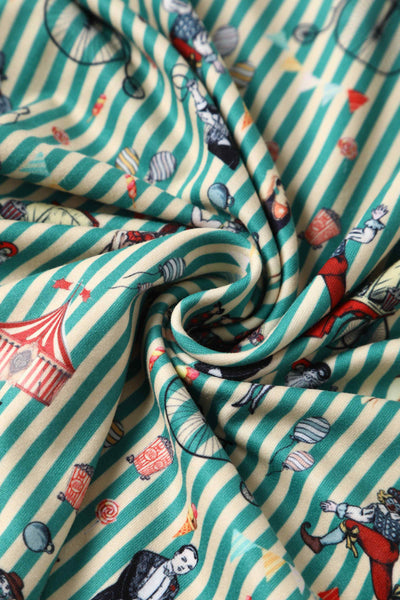 Close up View of Circus Print with Stripes Long Sleeved Swing Dress in Green