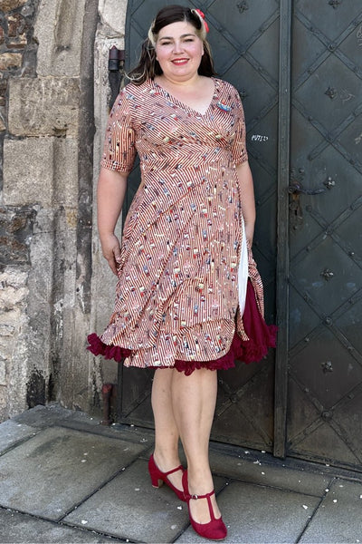 A lady wearing a Circus Red Striped Wrap Dress