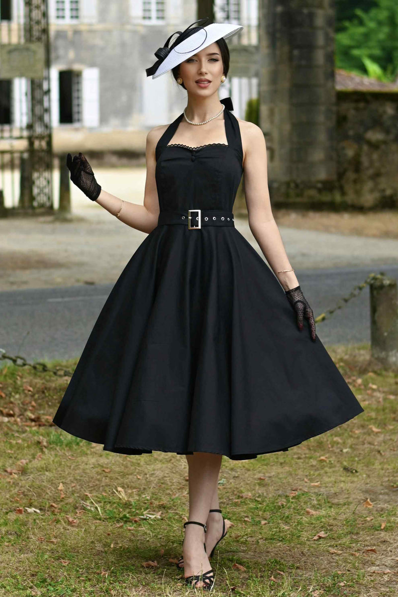 A model wearing a Daisy Classic Black Halter Dress