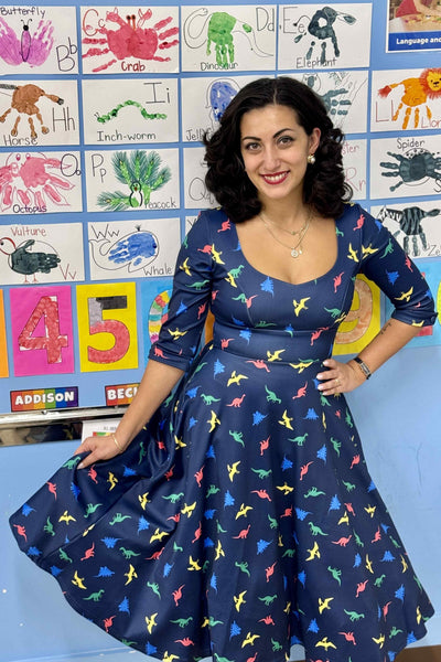 A lady wearing a Multicolour Dinosaur Midi Dress