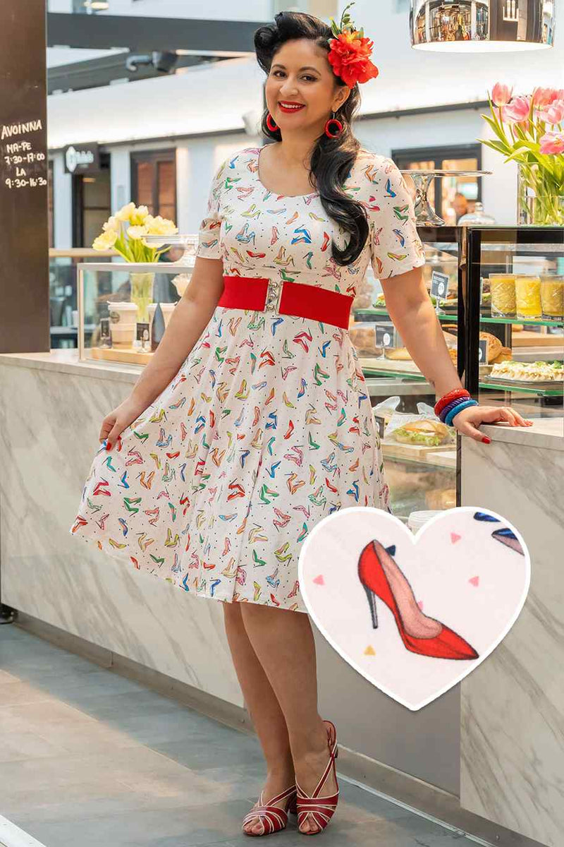 A lady wearing a Stiletto White Short Sleeved Dress