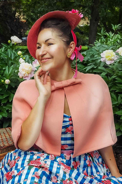 A model wearing Coral Pink Cape Jacket