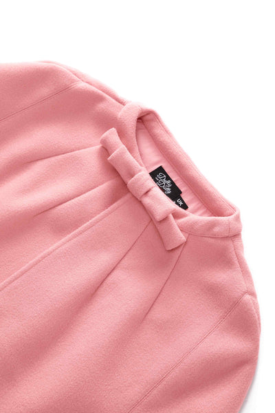 Close up view of a Sabrina Coral Pink Cape Jacket