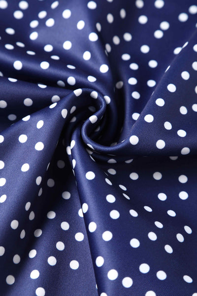 Close up view of Cross Strap Fitted Dress in Blue Polka Dots