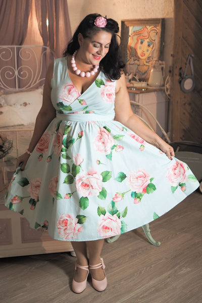 Woman wearing a May Crossover Bust Baby Blue Rose Dress