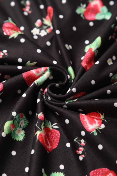 Close up of black/red strawberry print fabric